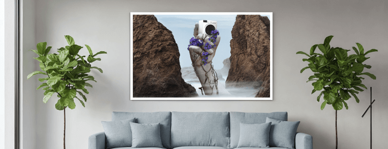 Modern living room with framed surreal art above a sofa