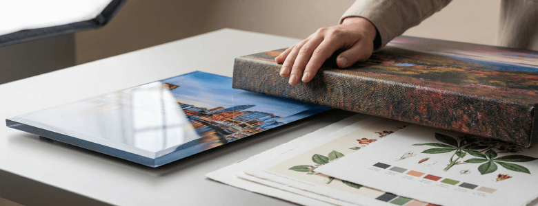 acrylic print and canvas photo print comparison on table for custom wall art printing