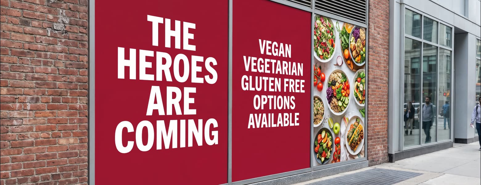 Restaurant storefront with custom window graphics promoting vegan, vegetarian, and gluten-free menu options.